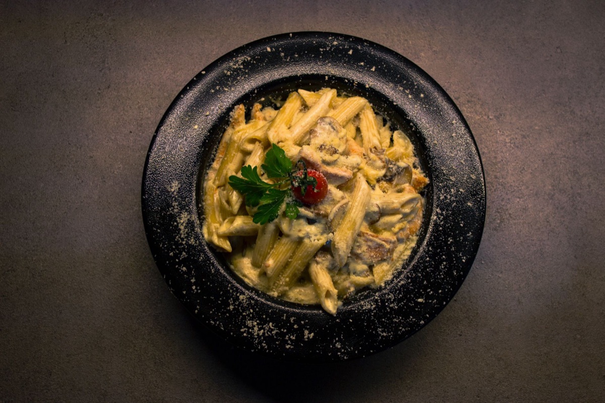 Creamy pasta sauce with grated cheese.